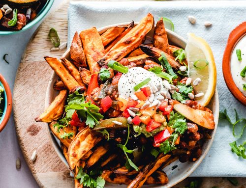 Spicy fries with vegetables salsa and melted cheese